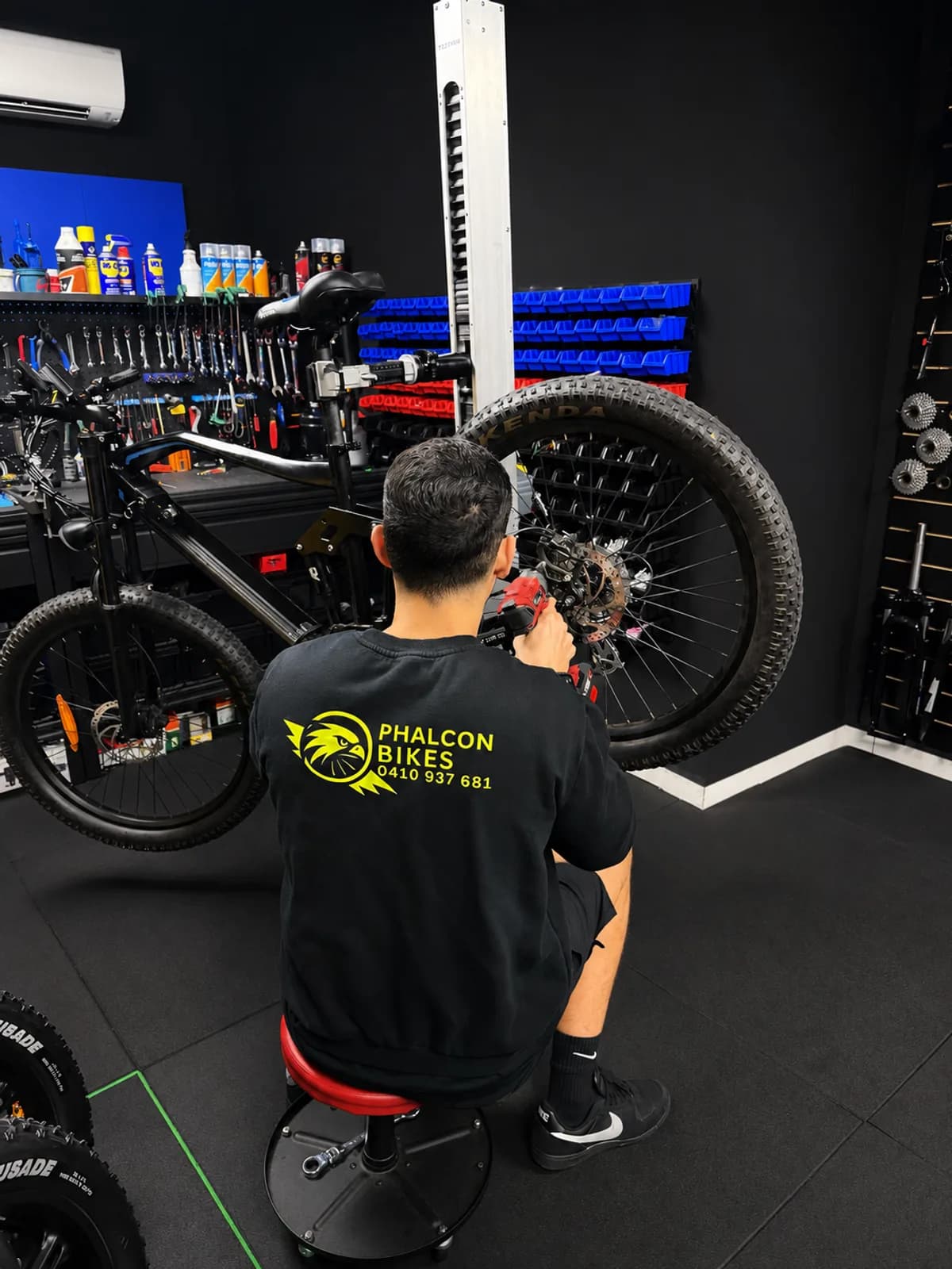 Phalcon Bikes mechanic servicing an E-Bike in the Chippendale workshop